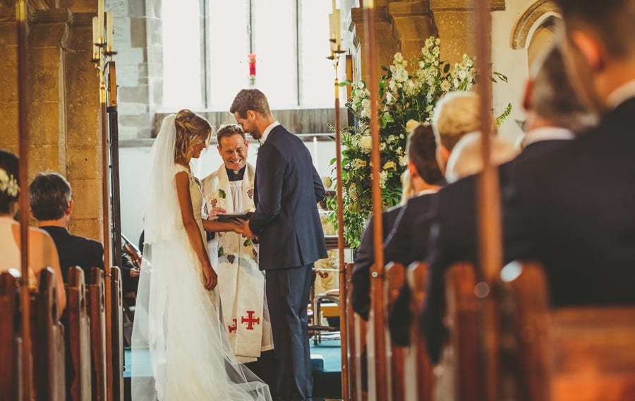 The groom places a ring on the finger of the bride in the Church during the ceremony