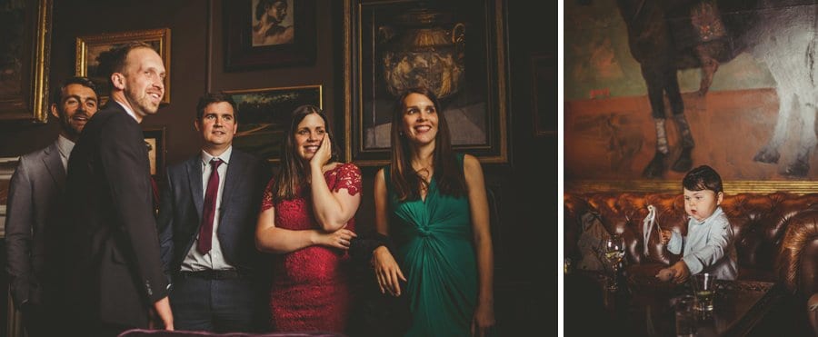 Wedding guests laugh with each other