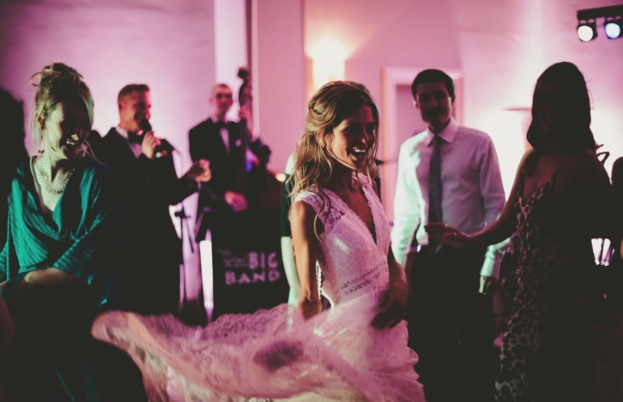 The bride dances with her wedding guests on the dancefloor at Stubton Hall