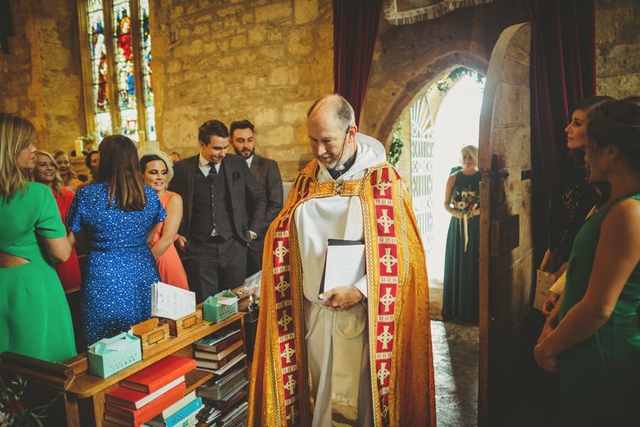 The vicar enters the Church