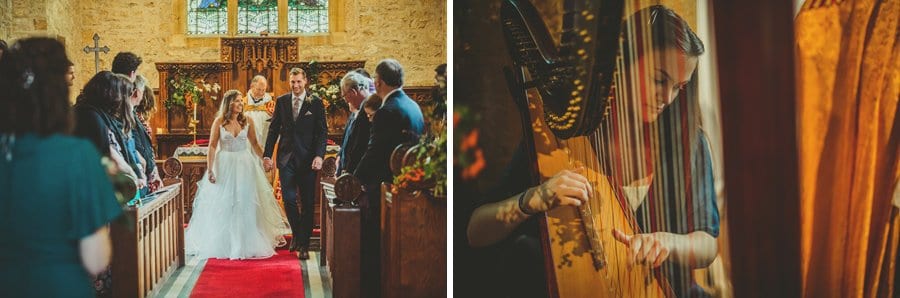 The bride and groom listen to a harpist play in the Church