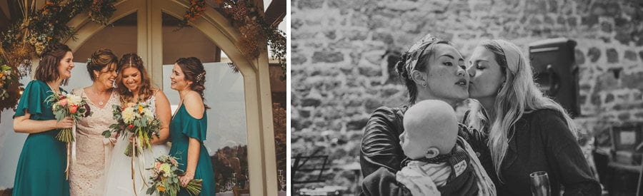 The bride's family pose for a photograph outside the Tithe Barn, Symondsbury
