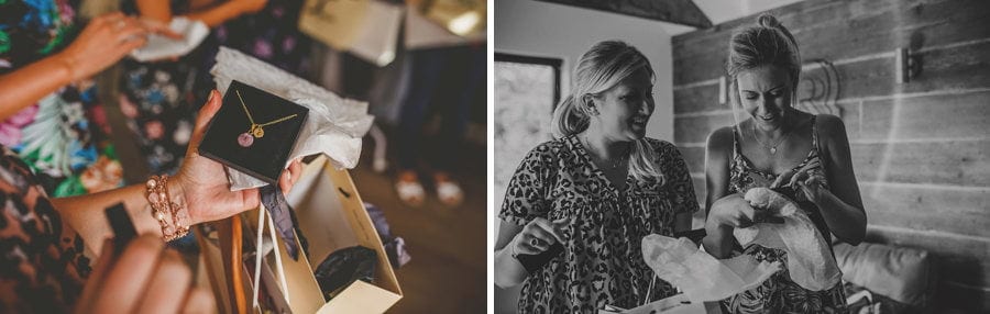 A bridesmaid opens a box with a bracelet inside it
