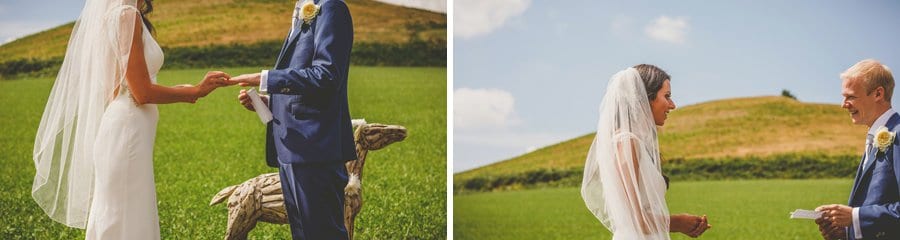 The groom reads the bride a poem during the outdoor ceremony at yurt retreat