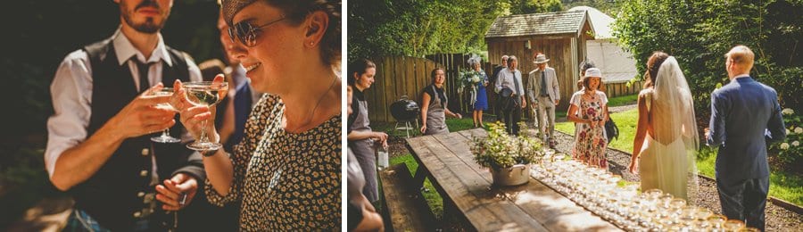 Wedding guests drink champagne and greet the bride and groom