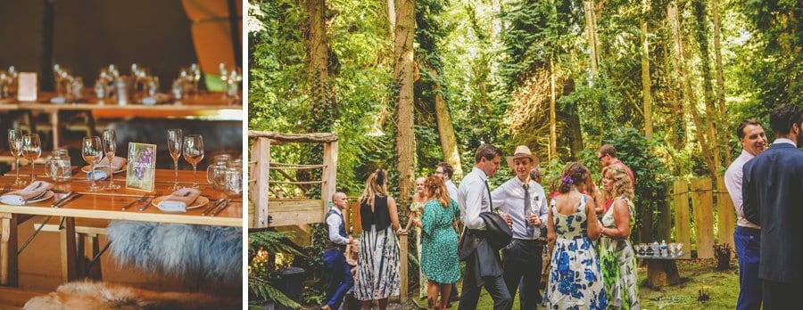 Wedding guests chat amongst themselves in the woods at yurt retreat