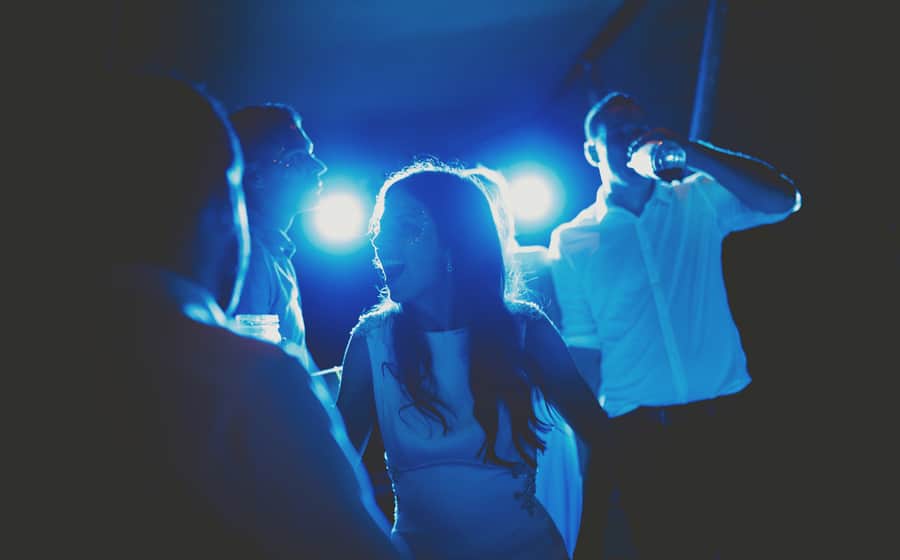 The bride dancing with friends and family