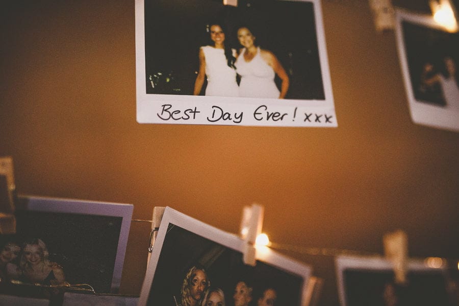 A polaroid photograph hangs from a piece of string in the tipi