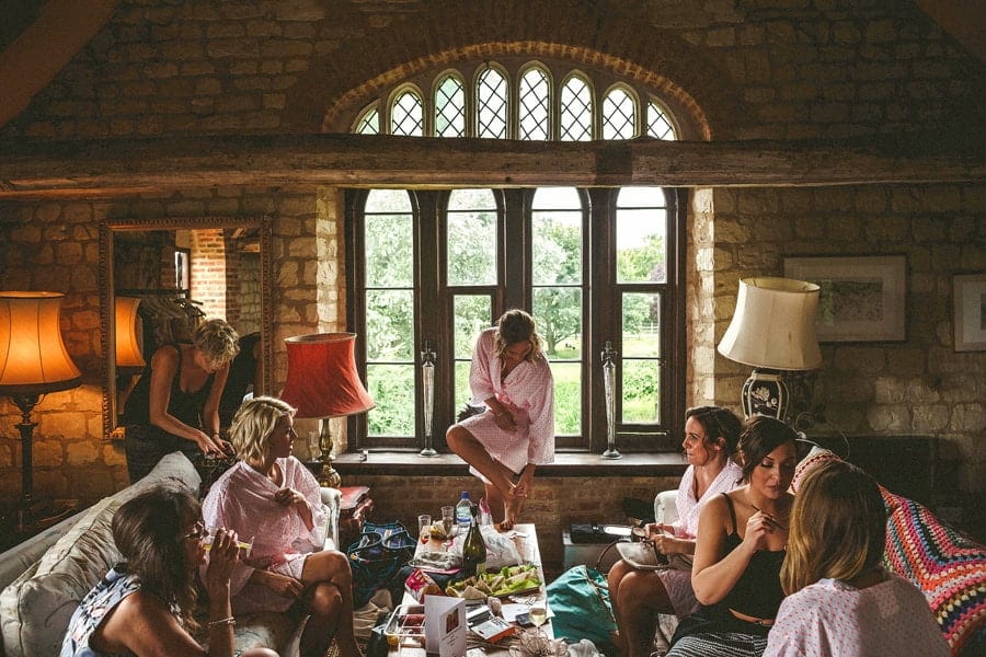 The bridal party getting ready in a barn