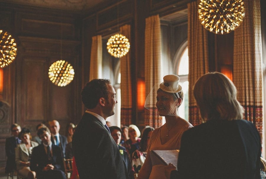 The bride and groom stand face to face and look at each other at Cowley Manor Hotel