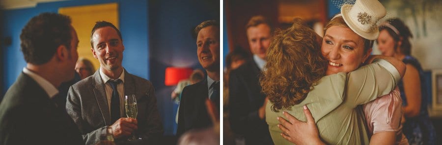 The bride embraces a wedding guest