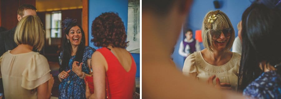 Wedding guests chat amongst themselves at Cowley Manor