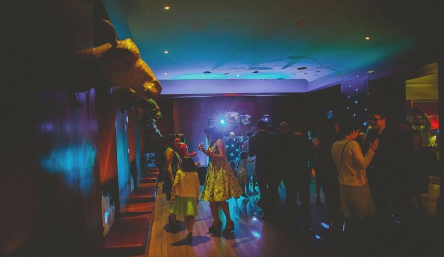 Wedding guests dancing on the dance floor at Cowley Manor