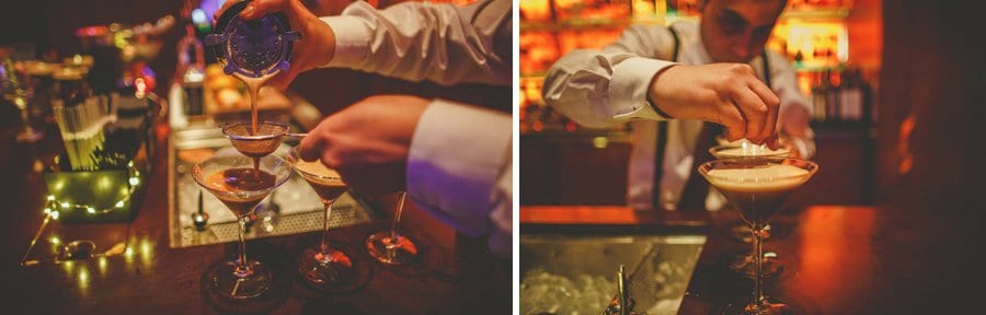 The bar man makes a cocktail drink on the bar at Cowley Manor Hotel