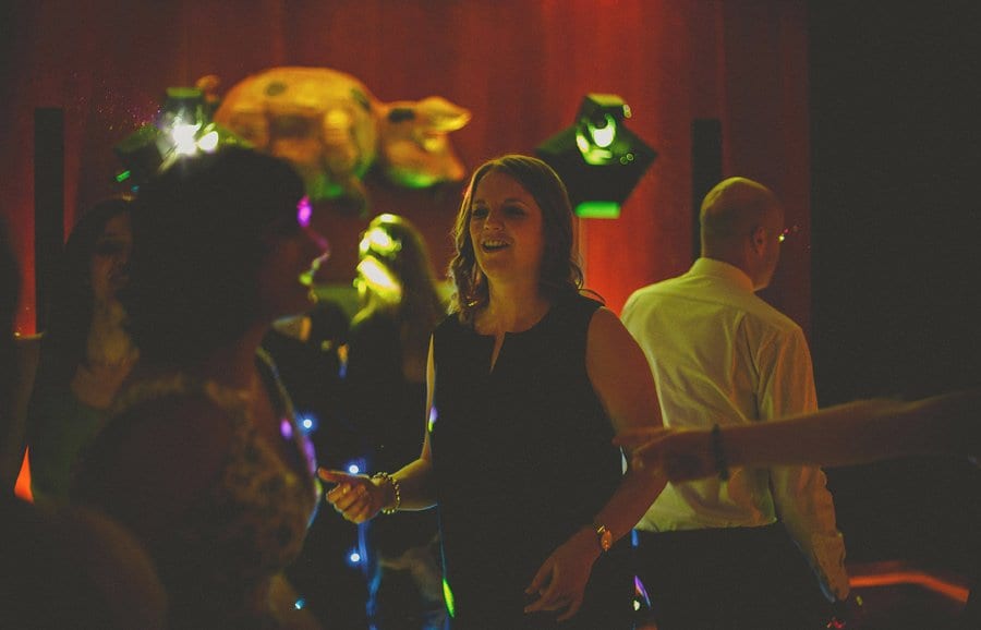 A lady dances with her friend on the dancefloor at Cowley Manor