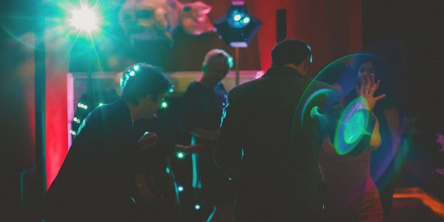 Wedding guests dancing together on the dancefloor