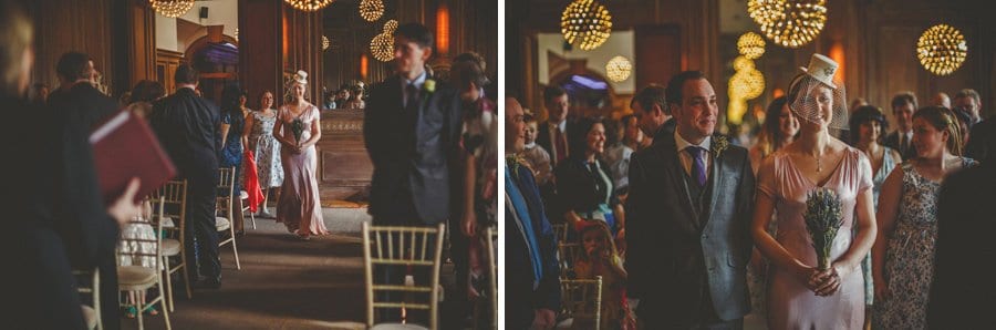 The bride walks down the aisle at Cowley Manor