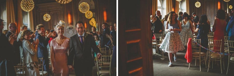The bride and groom walk down the aisle at Cowley Manor
