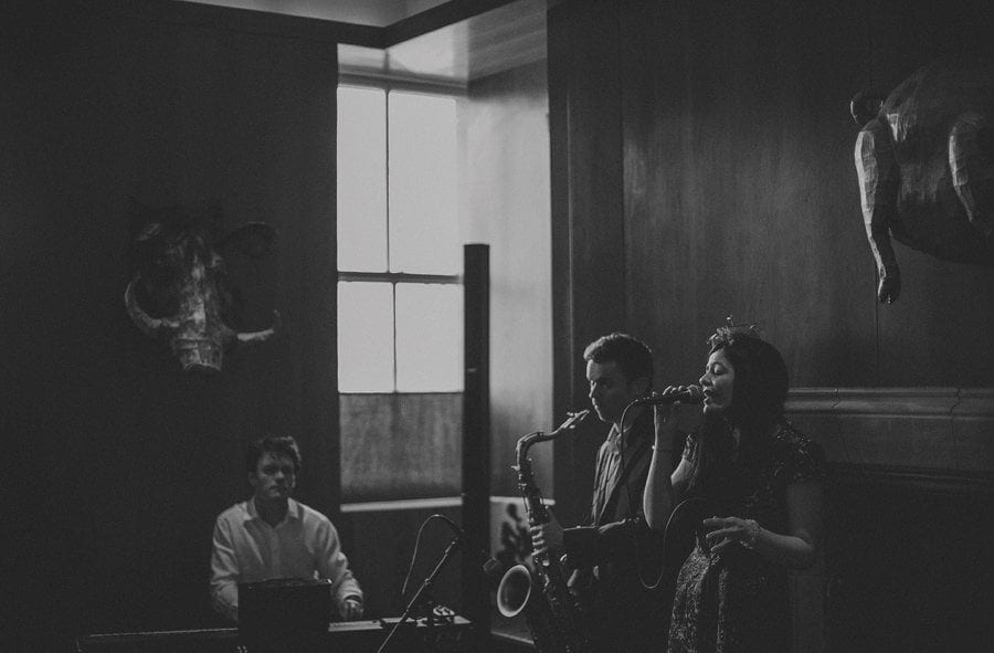 The wedding band perform a song for the wedding guests at Cowley Manor