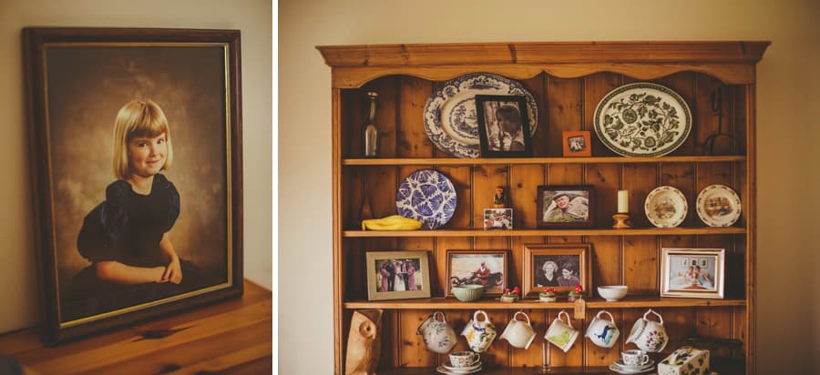 A wooden shelf cabinet with ornaments and photographs displayed