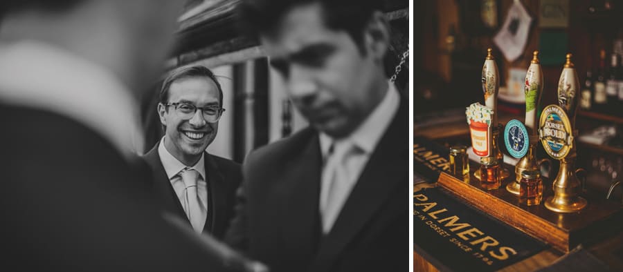 An usher laughs with the groom
