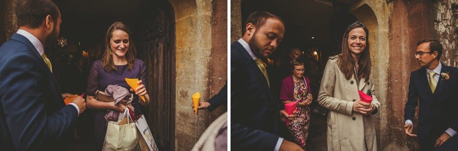 Wedding guests leaving the Church pick up confetti from a wicker basket