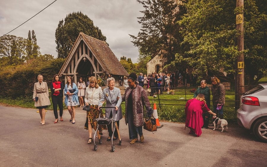 Wedding guests walk away from the church
