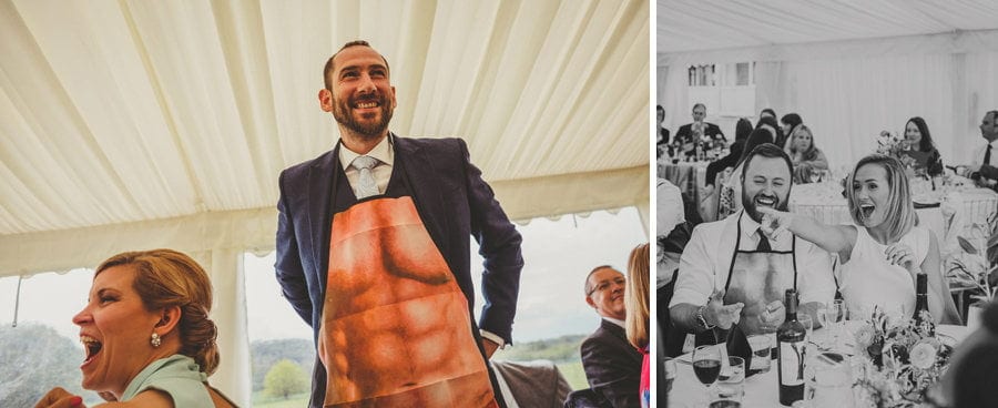 A wedding guest puts on an apron in the marquee