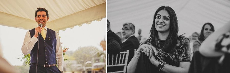 The best man delivers his speech to the wedding party in the marquee