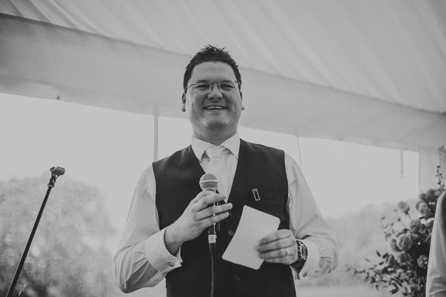 The best man speaks in the marquee