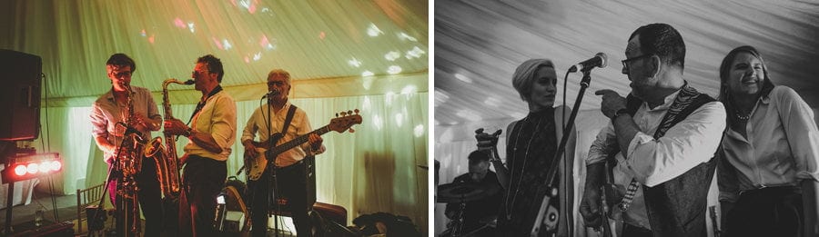 The wedding band perform on stage in the marquee