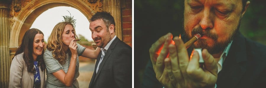 The wedding party smoke cigars in the grounds of Longstowe Hall