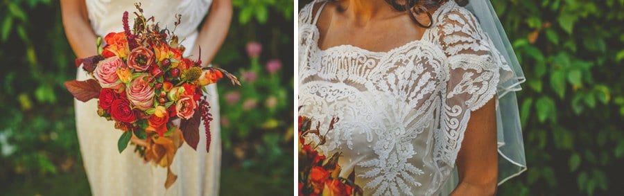 The bride holds her bouquet of flowers in both hands in her parents back garden