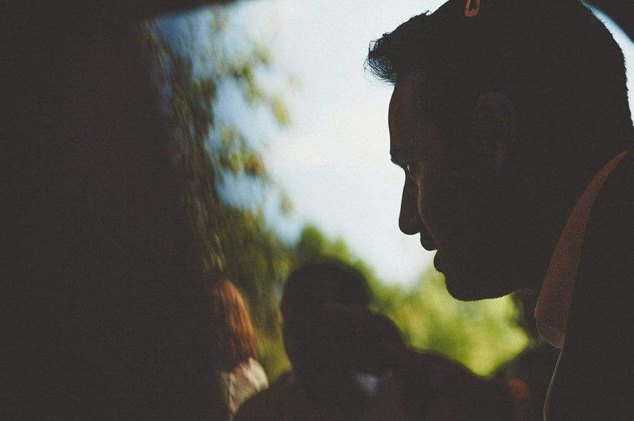 The groom listens to a friend