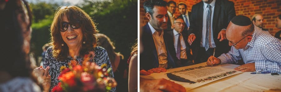 A lady sits and chats to the bride in the garden