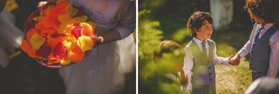 A flower girl holds a tray of paper petals