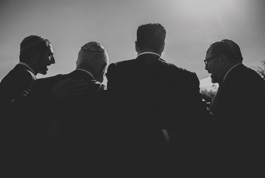 The groom and his family stand next to each other