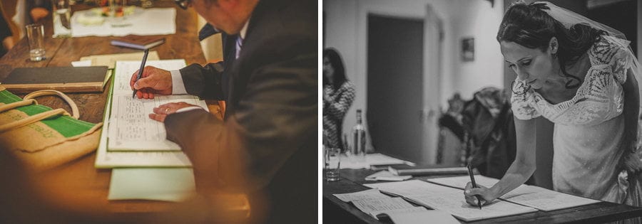 The bride and groom sign the wedding book