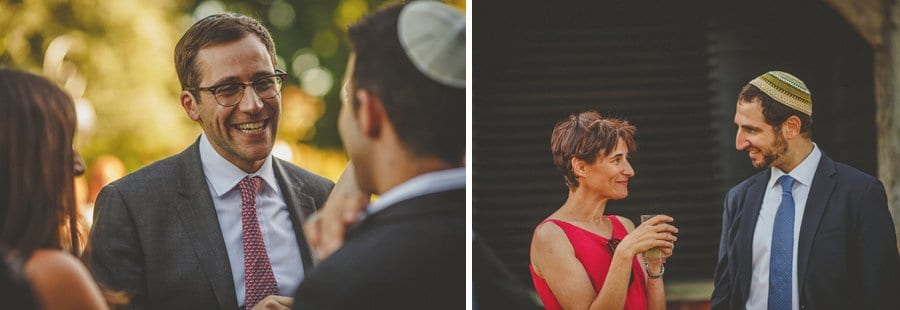 Wedding guests chat amongst themselves in the courtyard at Micklefield Hall wedding venue
