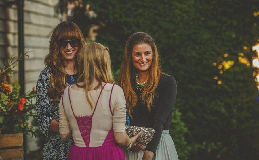 A lady chats with friends at Micklefield Hall wedding venue