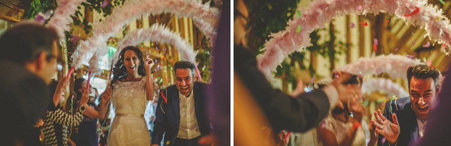 The bride and groom enter the barn holding each others hands at Micklefield Hall