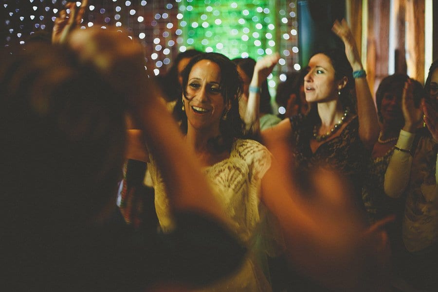 The bride dances with her family on the dancefloor at Micklefield Hall