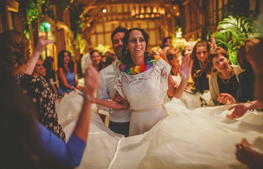 The bride and groom dance together on the dancefloor in the old barn at Micklefield Hall