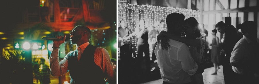 Thebride and groom dancing on their own and the wedding band singer sings into a microphone