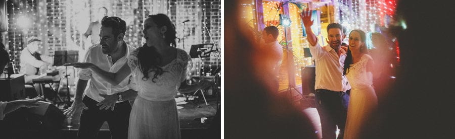 The bride and groom dance on the dancefloor in the barn