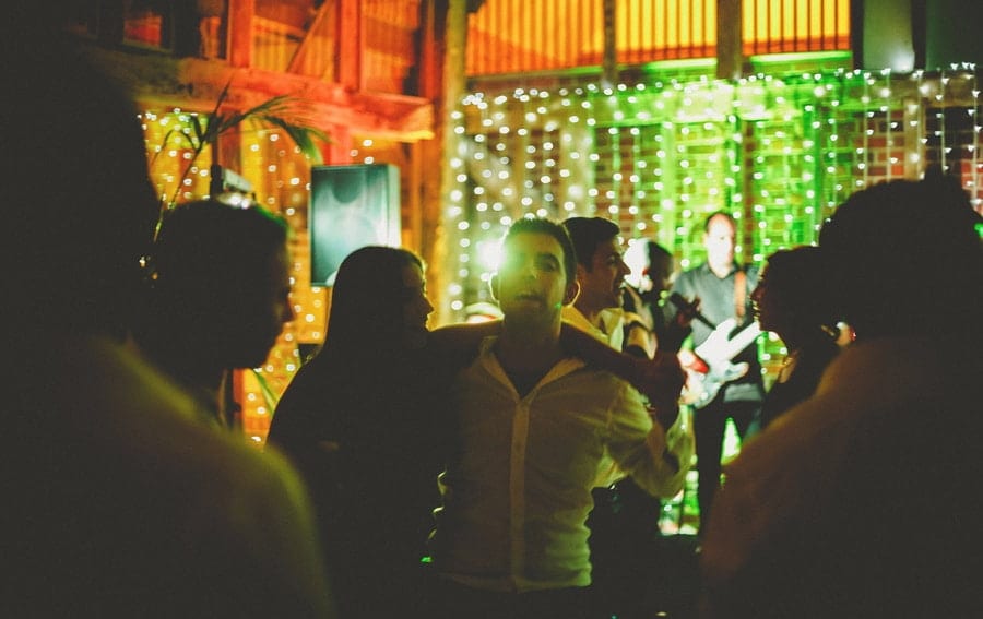 A wedding guest dances with his wife in the barn at Micklefield Hall