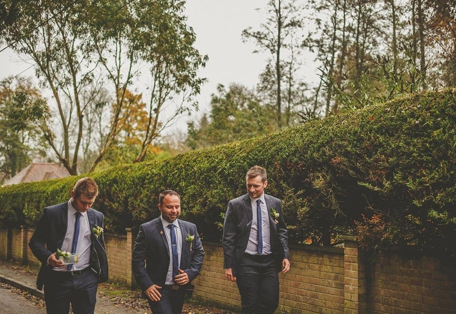 The groom and the ushers walk towards Sopley Mill