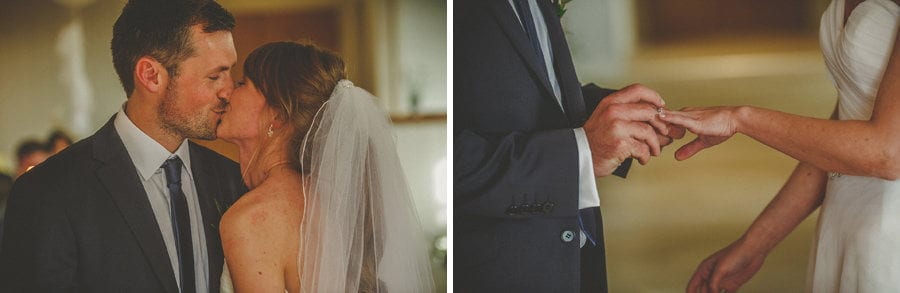The groom places a ring on the finger of the bride during the wedding ceremony