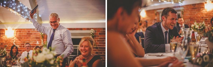 The groom laughs at the brides fathers wedding speech