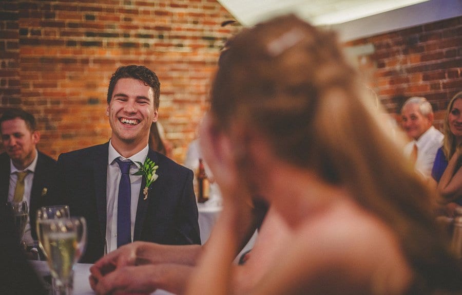 A wedding guest laughs during the wedding speechs